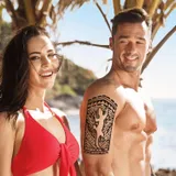 Tatouage maori bras salamandre