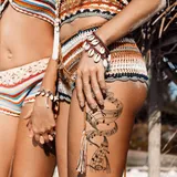 Tatouage temporaire femme Notes de musique